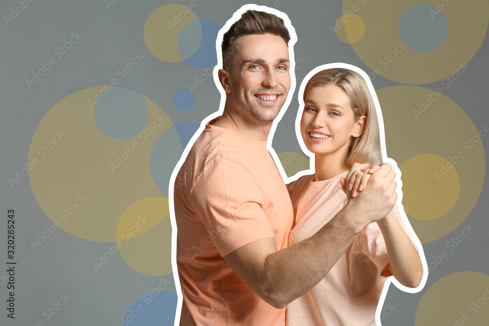 Happy dancing young couple on color background