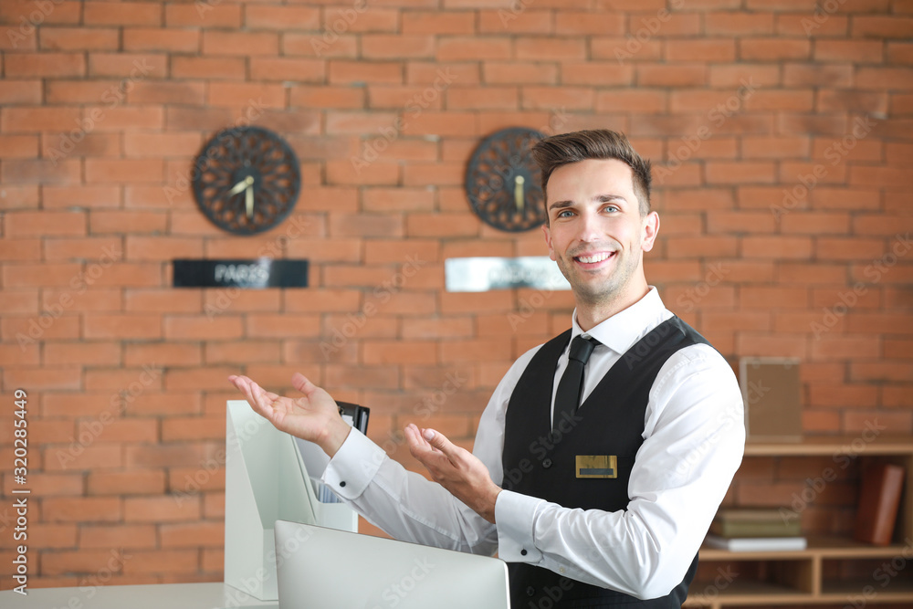 Portrait of male receptionist in hotel