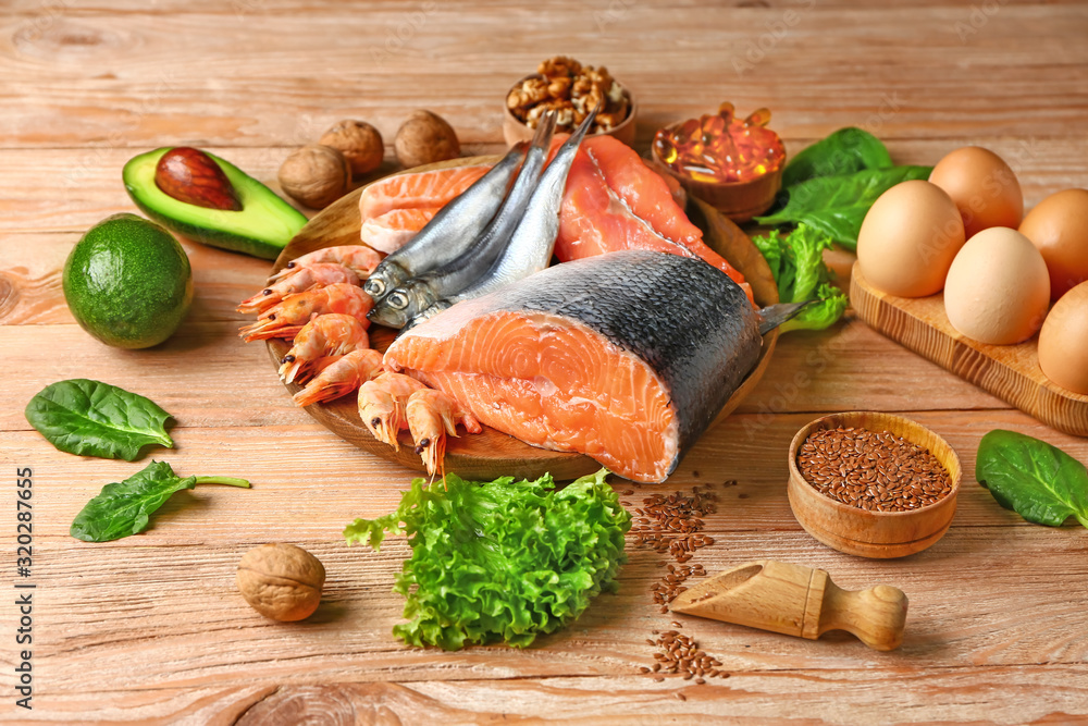 Healthy products rich in omega-3 on wooden background