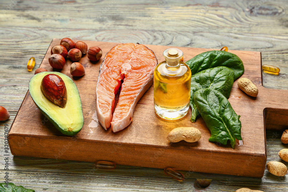 Healthy products rich in omega-3 on wooden background