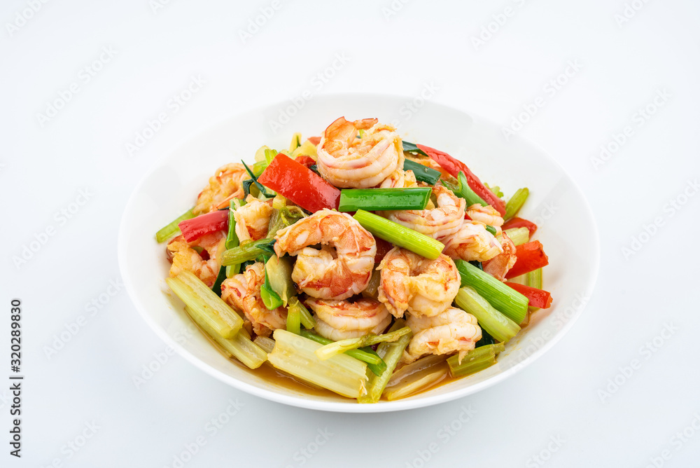 Stir-fried shrimp with celery in a dish on white background