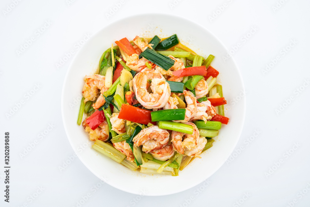 Stir-fried shrimp with celery in a dish on white background