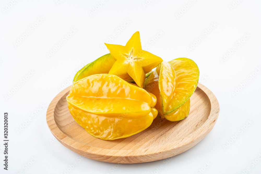 Fresh fruits carambola and pulp slices on white background