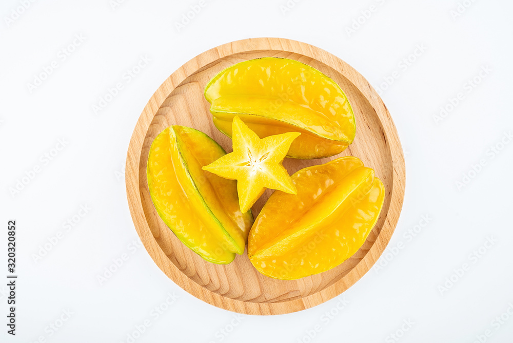 Fresh fruits carambola and pulp slices on white background