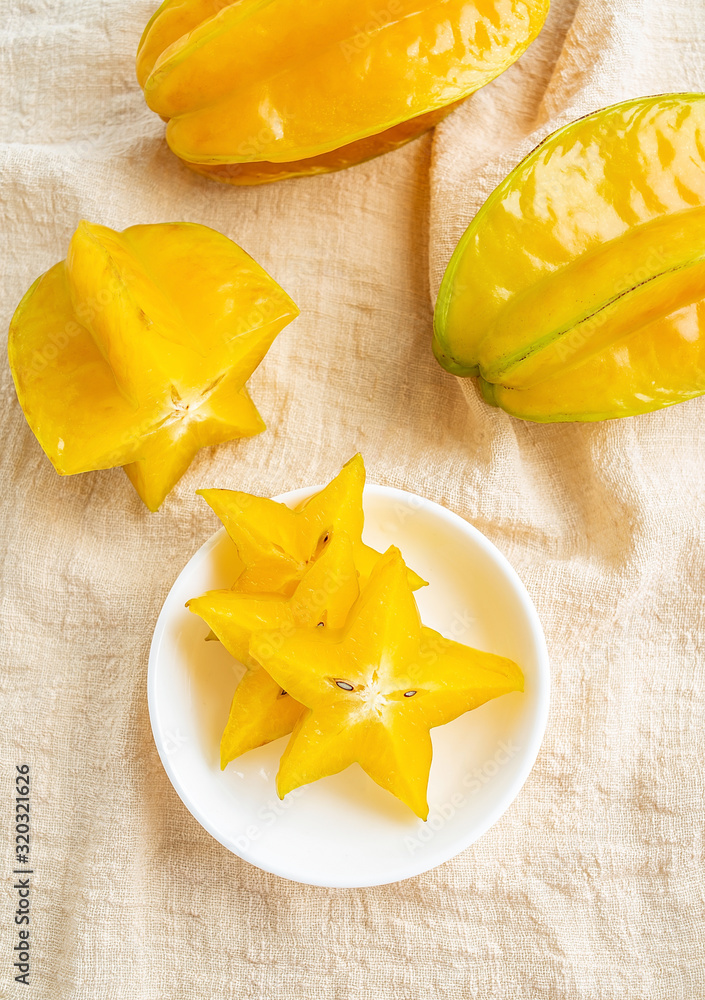 Golden yellow fresh carambola and pulp slices