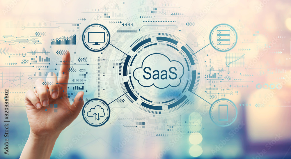 SaaS - software as a service concept with hand pressing a button on a technology screen