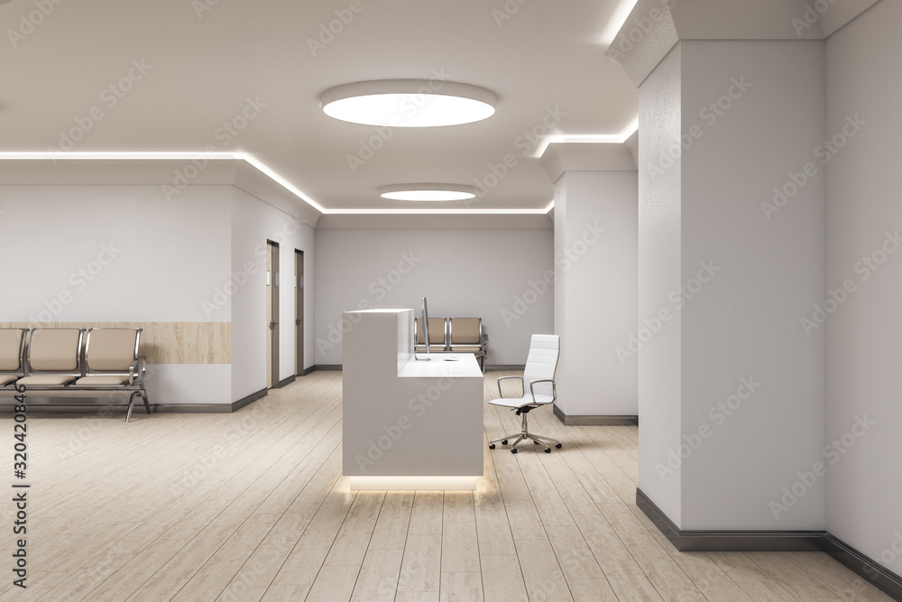 Modern reception desk with computer in medical office interior