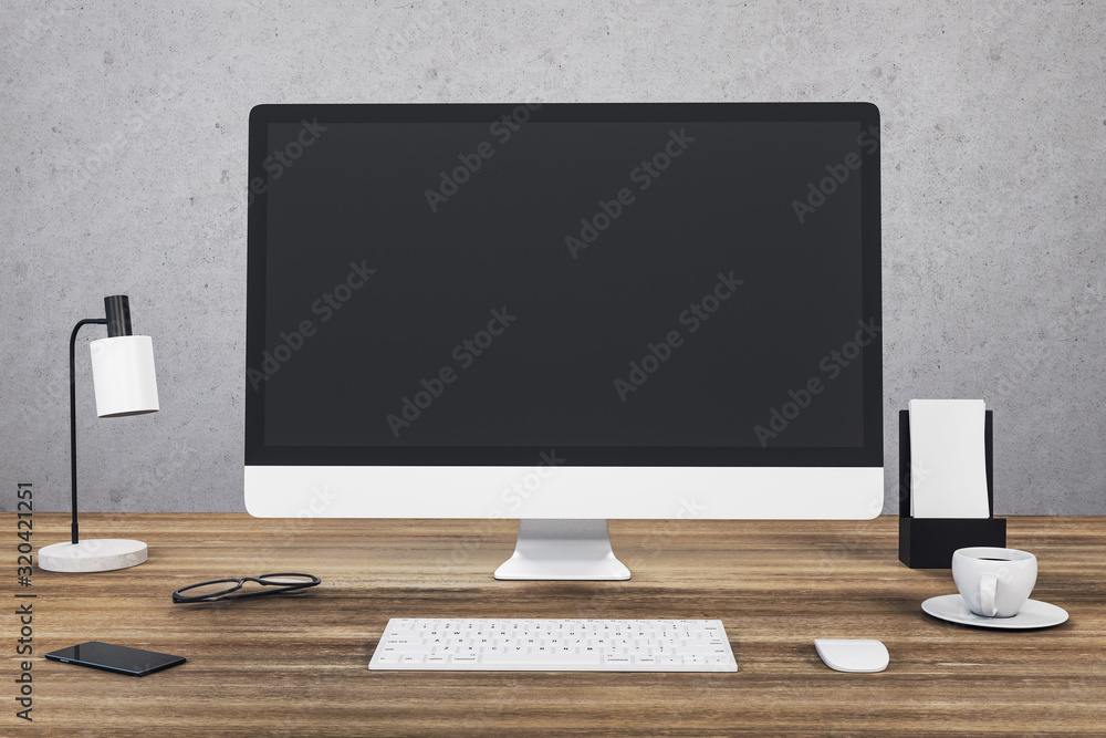 Designer desktop with computer on wooden table