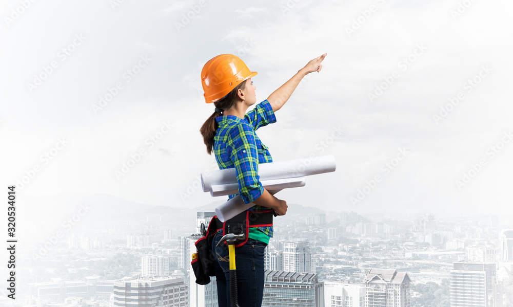 Woman architect in checkered blue shirt