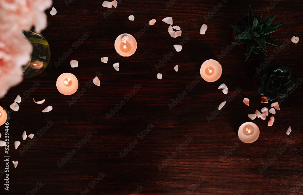 Dark flat lay with candles and flowers. top view occultism and fortune telling