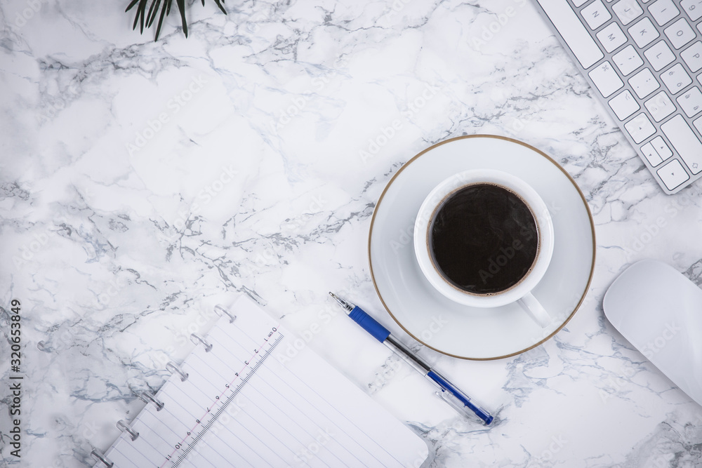 Black coffee on the desk with a computer, mouse Keyboard, book note, and pen Concept of working at h