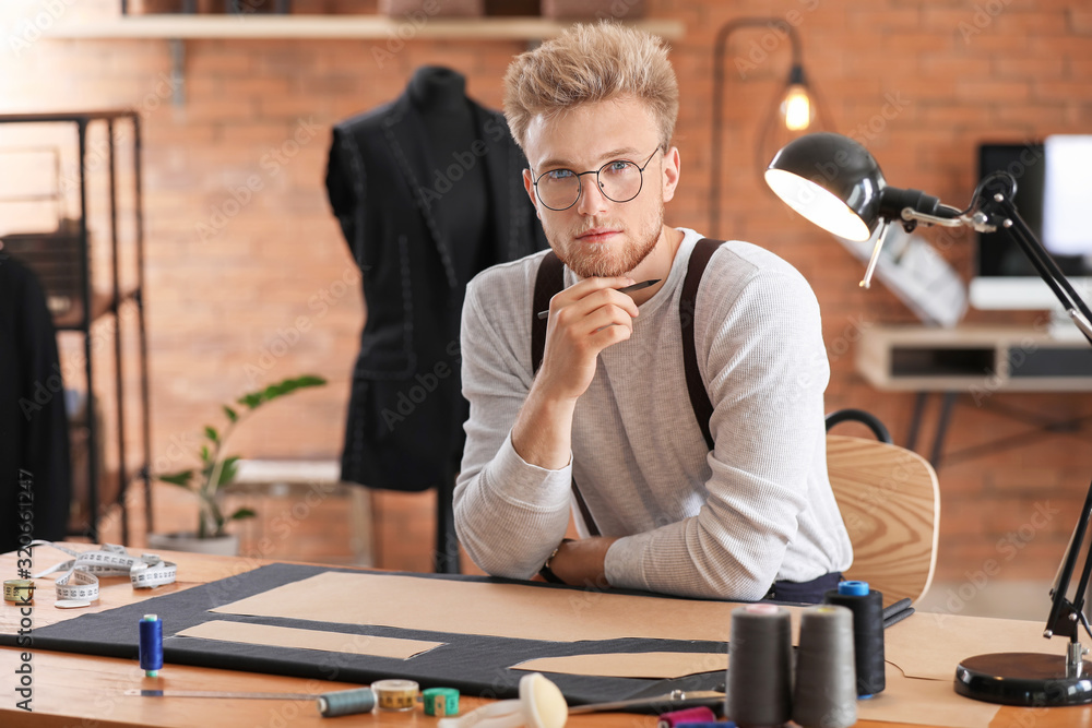 Portrait of male tailor in atelier