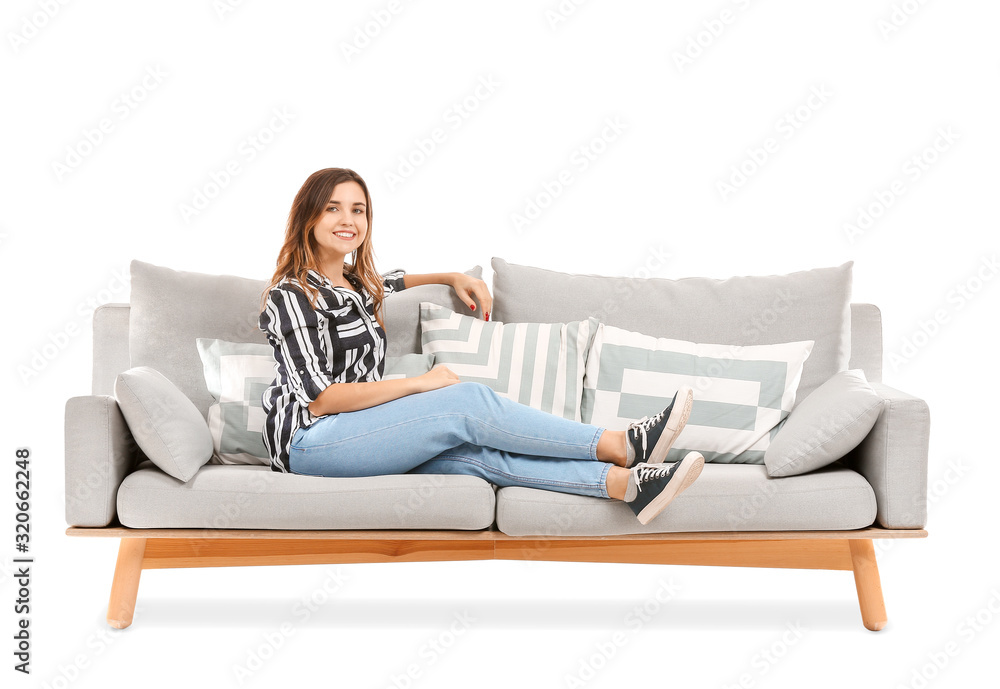 Young woman relaxing on sofa against white background