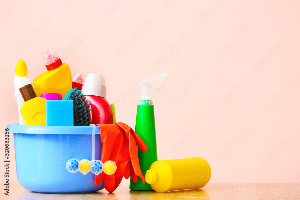 Set of cleaning supplies on color background