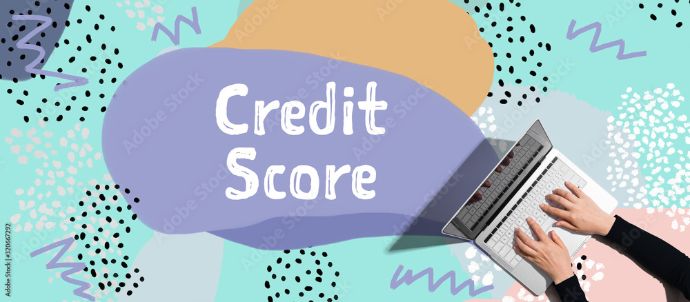 Credit score theme with person using a laptop computer