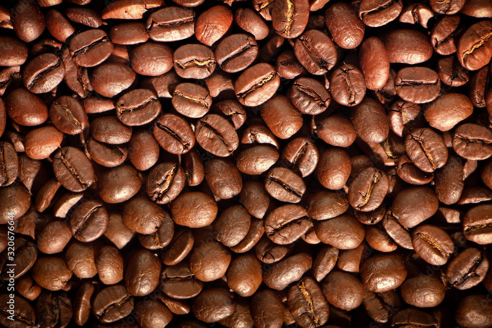 Coffee seeds, texture, natural organic dark background.