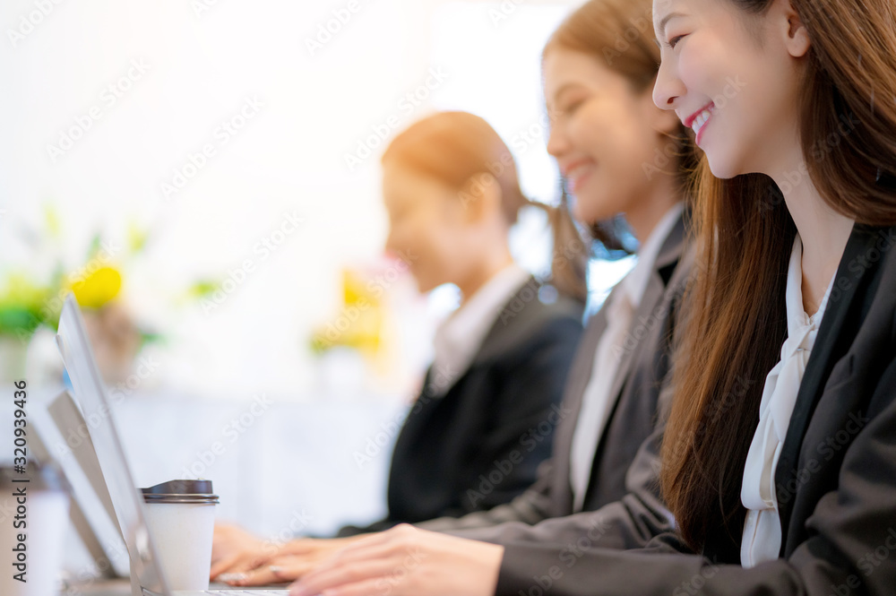 business asian female woman support service group working together with laptop with happiness and ef