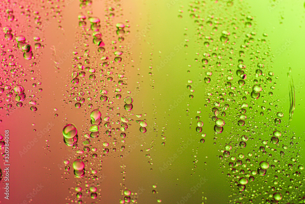 Drops of water on color background