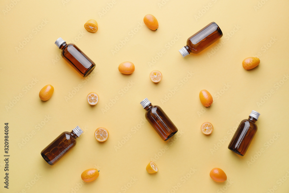 Cosmetic product in bottles on color background