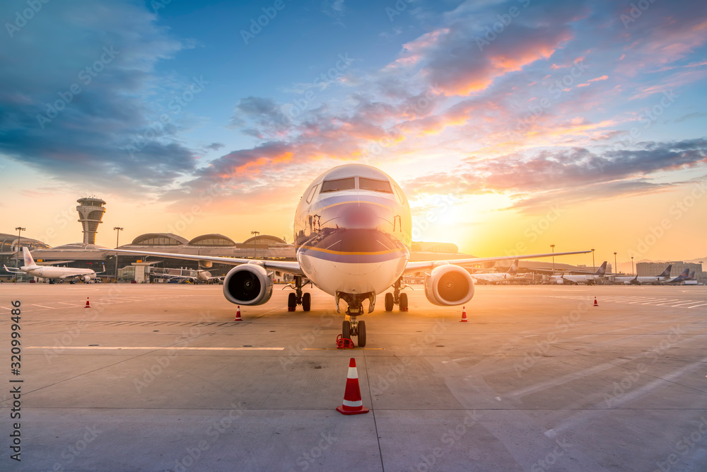 Airliner on airport runway and apron..