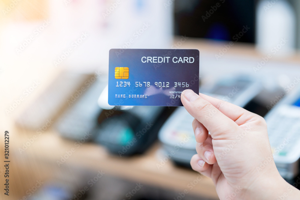 business shopping merchant ideas concept Close up of woman hand holding credit card for shopping wit