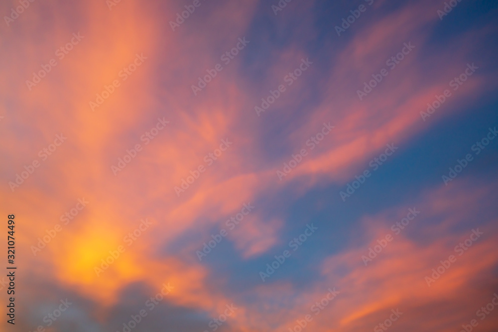 Colorful dramatic sky with orange clouds