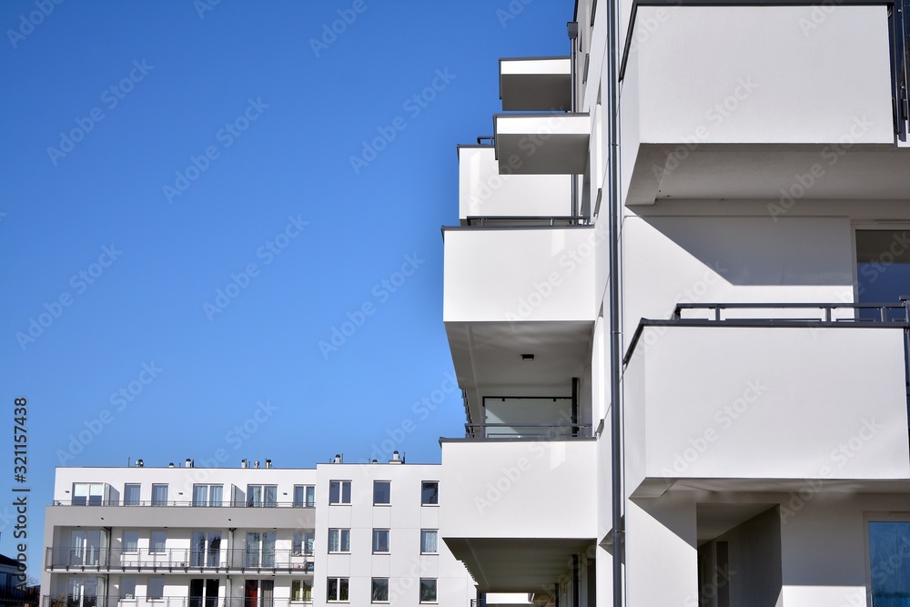 Contemporary residential building exterior in the daylight. Modern and new apartment building. 