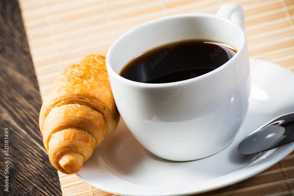 Cup of espresso coffee on wooden table