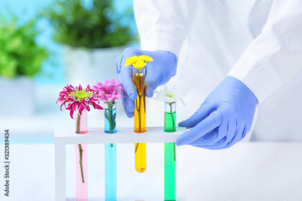 Scientist working with flower samples in laboratory