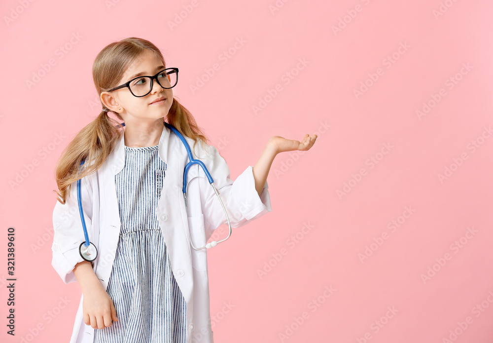 Cute little doctor on color background