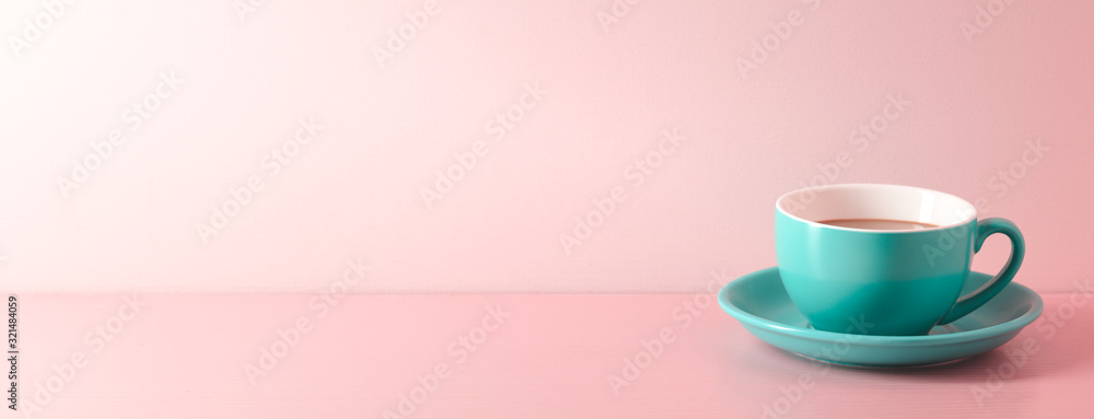 A cup of fresh coffee on pink background