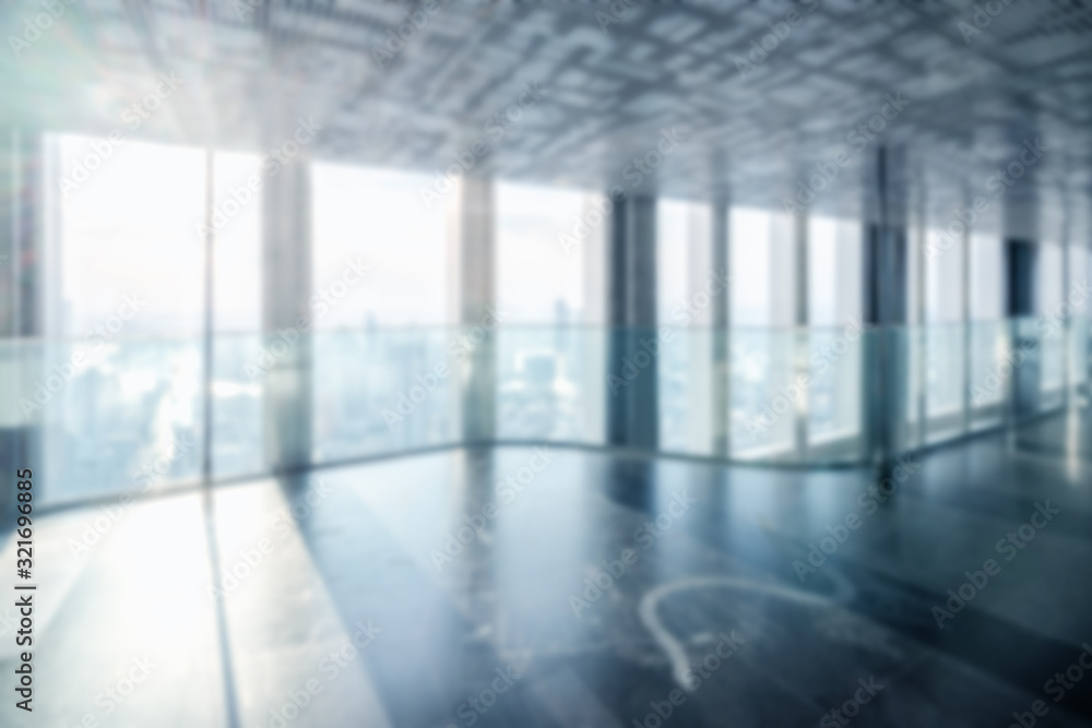 Blur background of empty office interior in city downtown. Modern workplace and conference hallway.