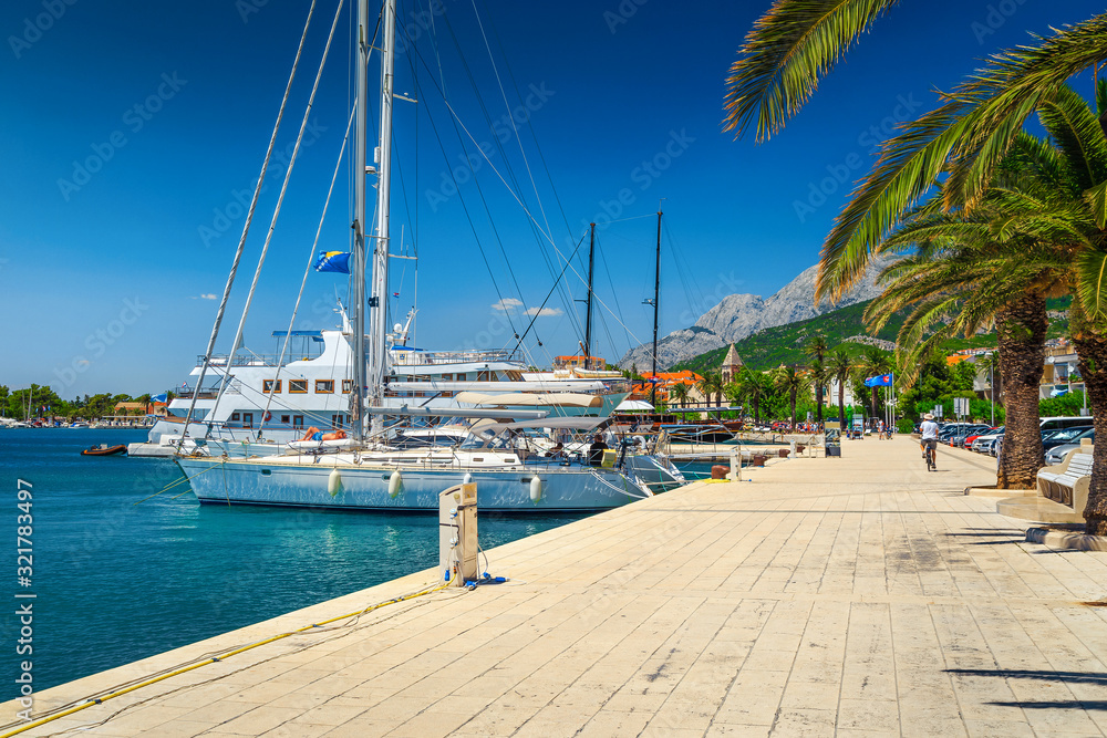 Mediterranean cityscape and harbor with boats and yachts, Makarska, Croatia