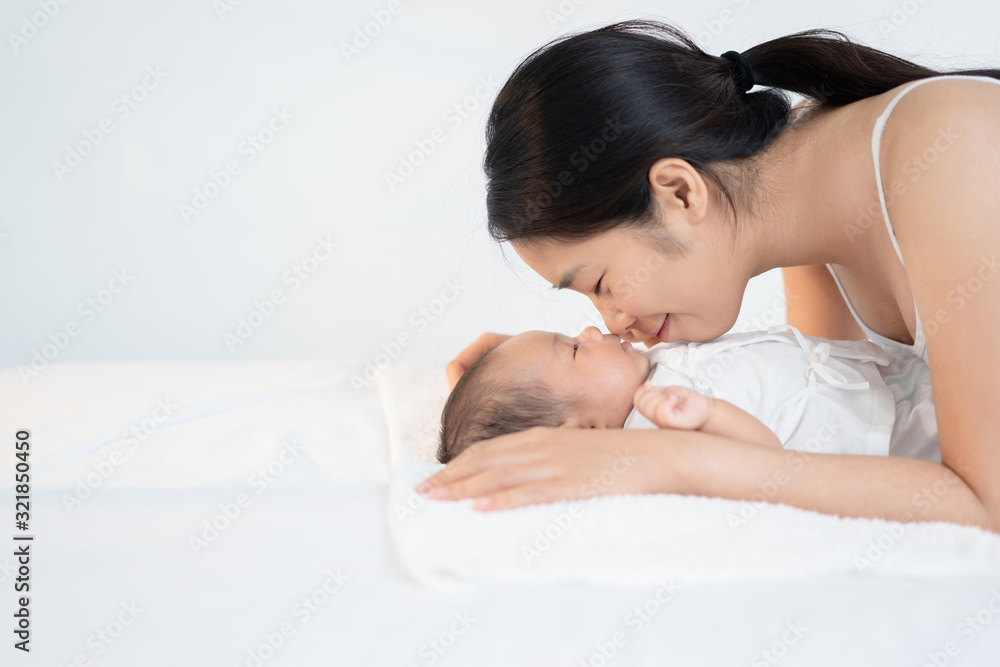 Happy asian mother with baby