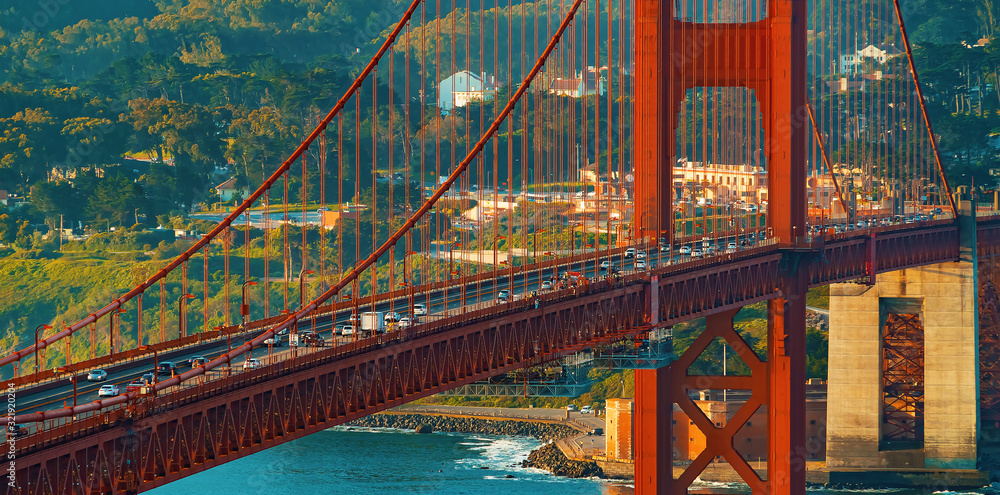 Traffic passes over San Franciscos Golden Gate Bridge from Marin County