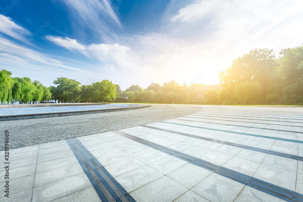 Empty square floor and beautiful sky clouds with green forest.