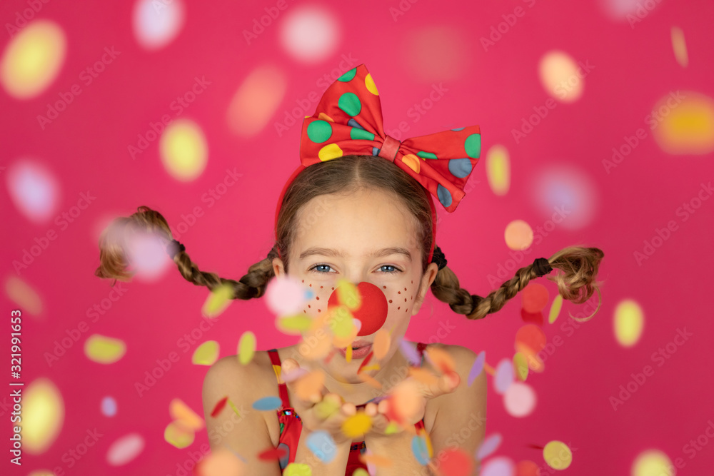 Funny girl clown playing indoor