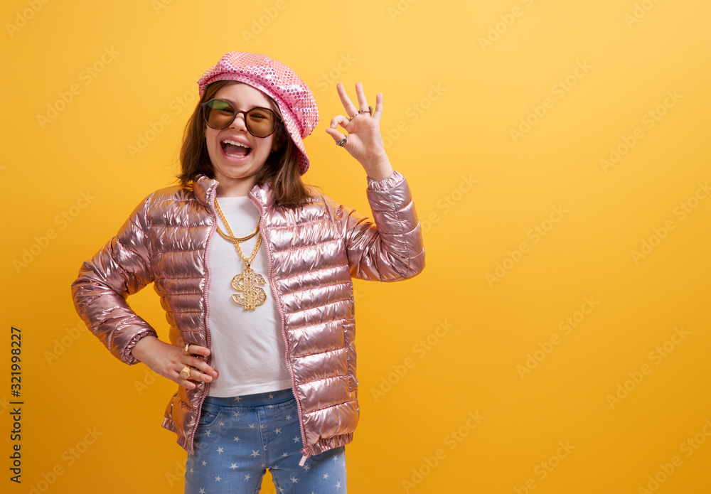 Kid on bright color background.