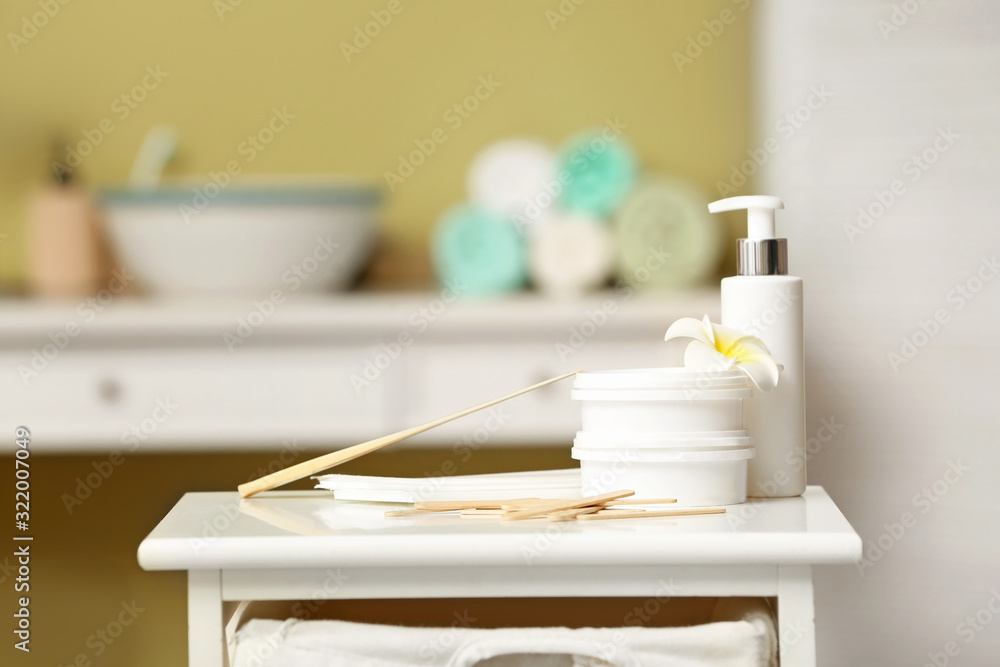 Set for hair removal on table in bathroom