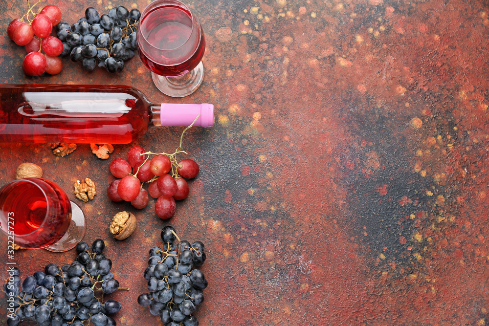 Delicious wine with nuts on color background