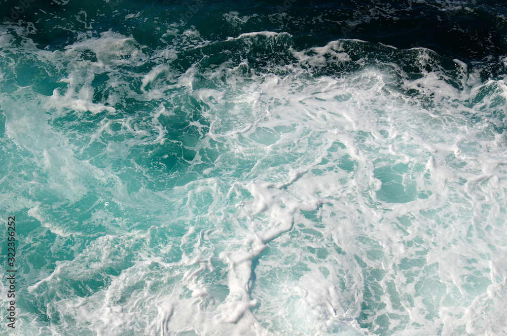 Aerial view to ocean waves.