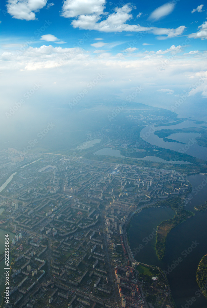 Aerial view of a green landscape with a river