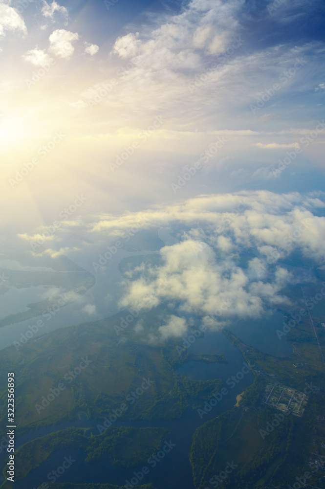 Aerial view of a green landscape with a river