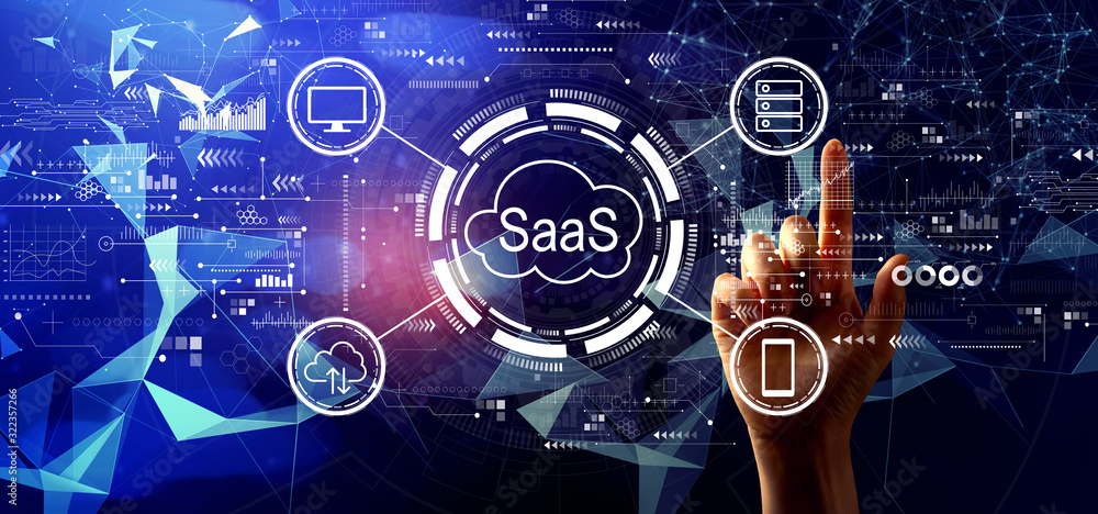 SaaS - software as a service concept with hand pressing a button on a technology screen