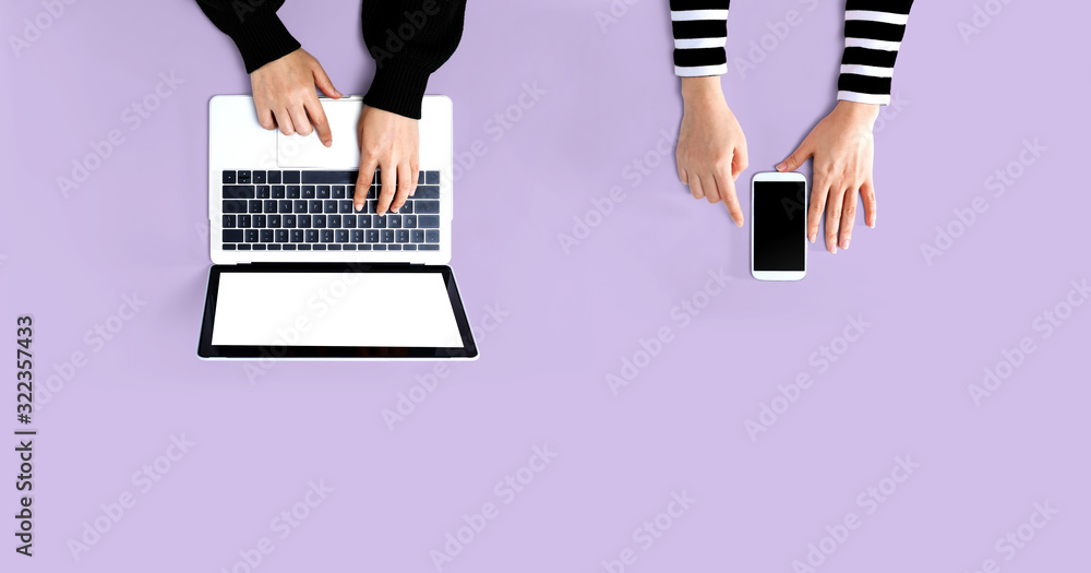 People working together with laptop and phone