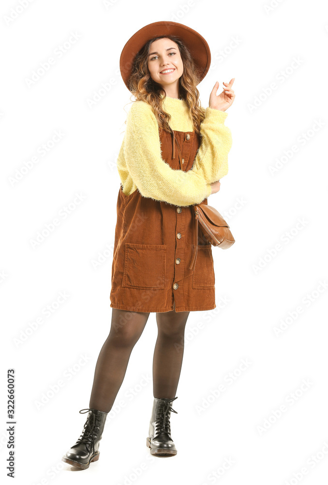 Beautiful young woman in warm sweater on white background