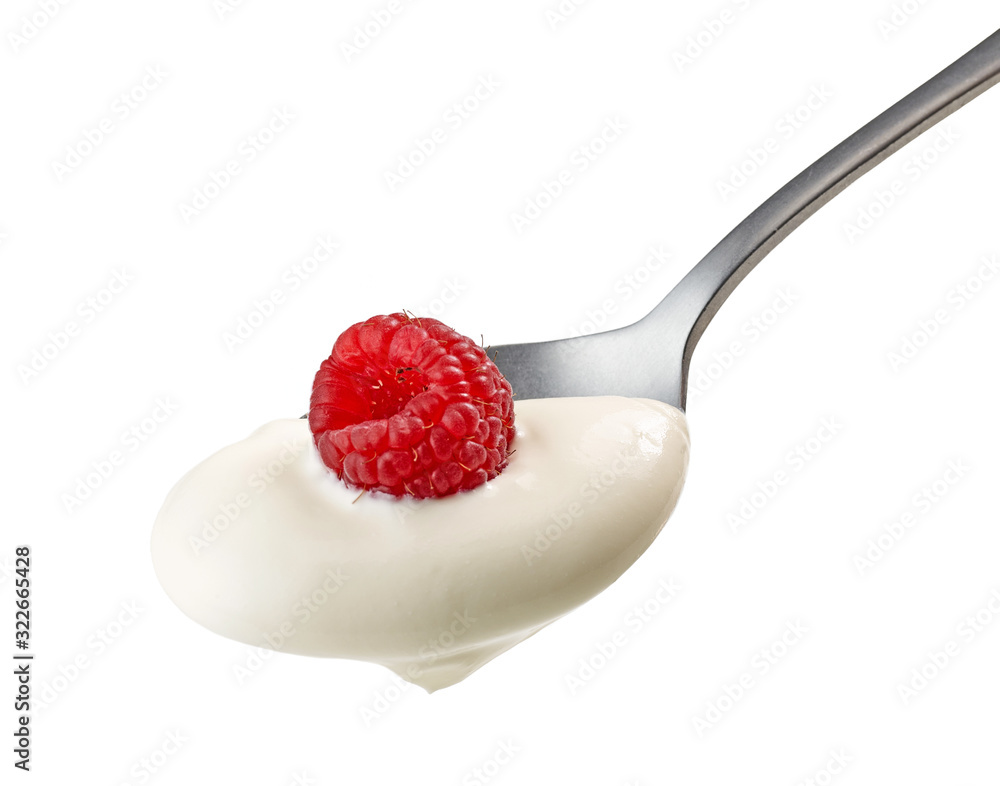 spoon of yogurt cream with raspberry