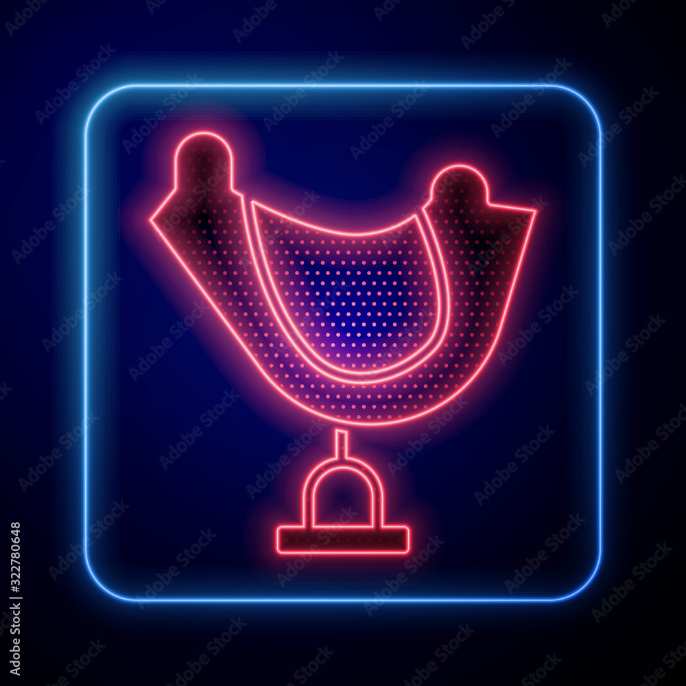 Glowing neon Wild west saddle icon isolated on blue background.  Vector Illustration