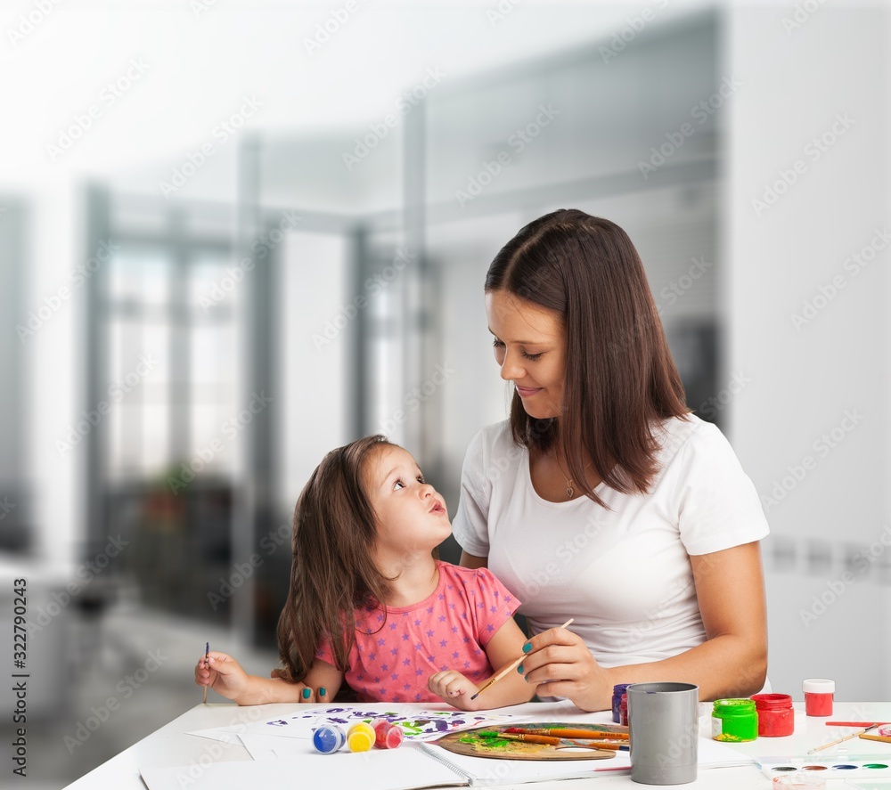 Happy beautiful mother and daughter playing together