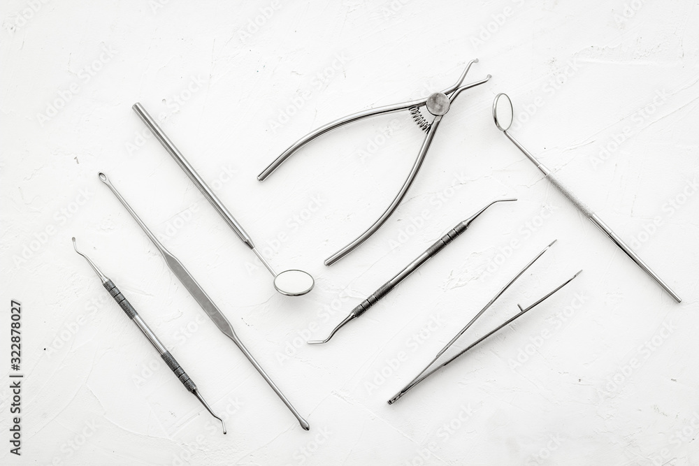 Dental instruments - set with mirrors - on white background top-down pattern